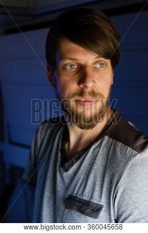 Handsome Young Caucasian Man With A Beard Portrait, Looks Outside Of The Train's Window, Looking Bor