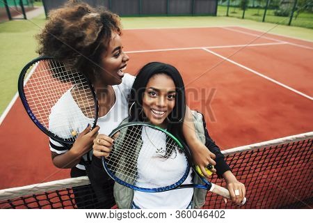 Young Pretty African Girlfriends Hanging On Tennis Court, Fashion Stylish Dressed Swag, Best Friends