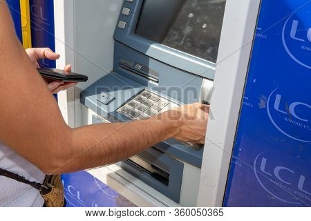 Bordeaux , Aquitaine / France - 03 03 2020 : Lcl Atm Cash Machine With Woman Customer French Bank Si