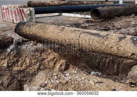 repair and replacement main pipeline of heating systems, district heating pipes network, water supply or Sewerage in city, removing old pipes and replacing them with new ones in a hole in the ground