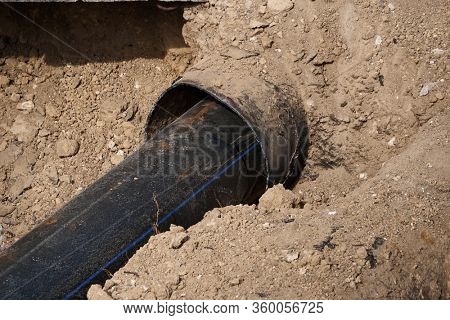 repair and replacement main pipeline of heating systems, district heating pipes network, water supply or Sewerage in city, removing old pipes and replacing them with new ones in a hole in the ground