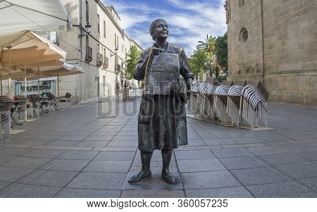 Caceres, Spain - Nov 7th, 2019: Newspapers Saleswoman Bronze Sculpture. Memorial Statue To Leoncia G