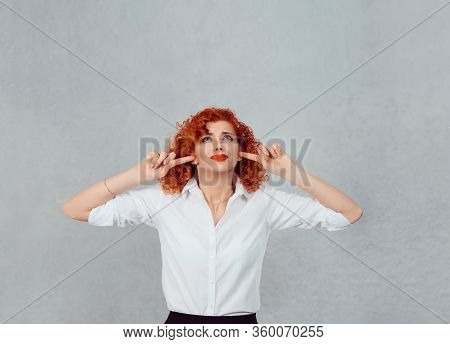 Occlude The Ears. Closeup Portrait Young Angry Unhappy Stressed Redhead Curly Woman Covering Pluggin