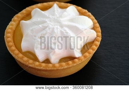 Tartlet With Lemon Cream And Whipped Squirrels. Round Cake On A Shortcrust Pastry. Shortcrust Tartle