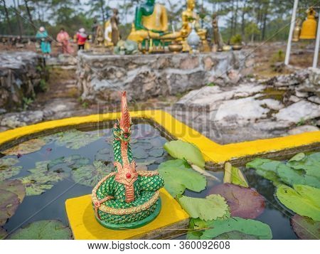 Naga Statue In The Water Pond On Lanpresrinakarin On Top Of Phu Kradueng Mountain  In Loei City Thai