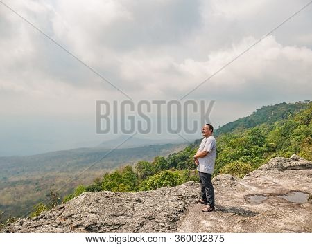 Asian Fat Trekker On Yeabmek Cliff Phu Kradueng Mountain National Park In Loei City Thailand.phu Kra