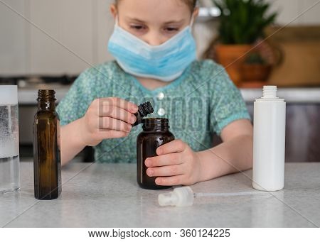 Kid Girl Makes Sanitaizer Or Antiseptic Gel At Home. Hygiene During Coronavirus Epidemic. Concept Of