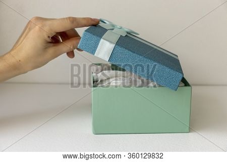 Gift Boxes With Ribbons And On A White Background.
