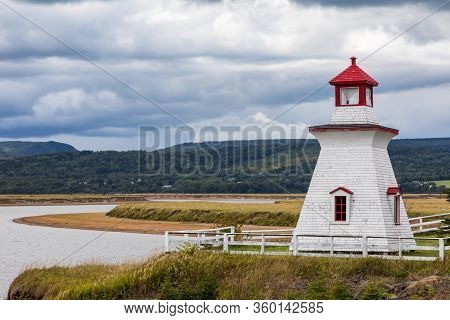 Anderson Hollow Lighthouse By The Shepody River Dam In Harvey, Bay Of Fundy, New Brunswick. Beautifu