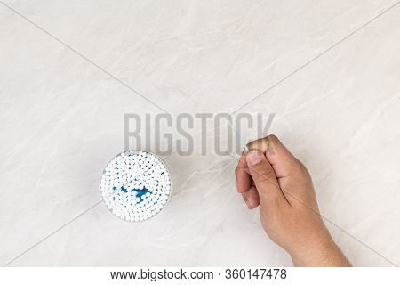 Ear Swab Package With Male Hand Holding Ear Swab With Copy Space