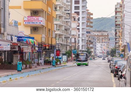 Alanya, Antalya Province, Tureky - Jun 09, 2019: Bus Goes To The City Center Of Sunny Alanya Along M
