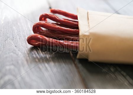 Biltong Or Jerked Meat. Traditional South African Dried Meat . Biltong Strips In Craft Pack. Grey Wo