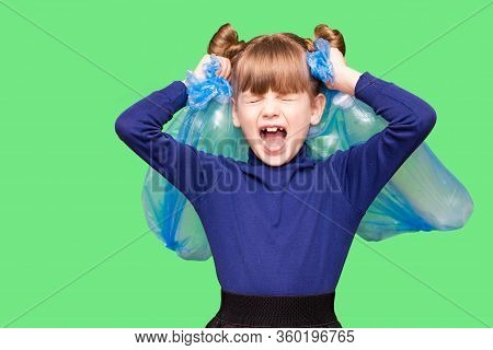 Little Girl Holding Plastic Bottles With Close Eyes And Screams For Help In Protecting Our Planet Fr