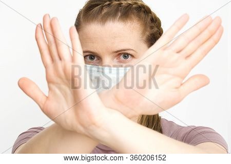 Say Stop For Coronavirus. Beaterfull Woman In Face Surgical Mask Show Stop By Hand, Gesture For Stop