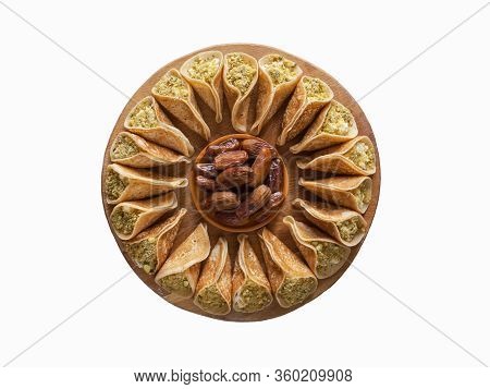 Isolated Arab Sweets. Arabian Pancake Stuffed With Sweet Cheese, Dates And Pistachios.