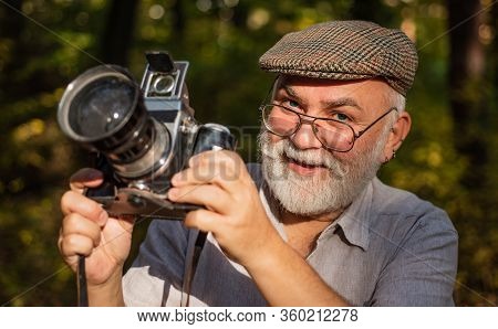 He Likes Birdwatching. Pension Hobby. Experienced Photographer. Vintage Camera. Old Man Shoot Nature