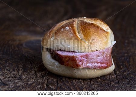 Bavarian Meat Loaf In A Bun On Wood