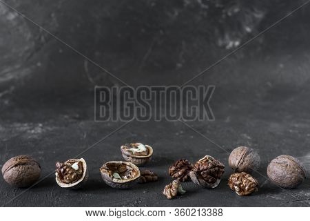 Halves Of The Kernel Of A Healthy Walnut Without Shell On A Dark Background, Walnut Macro Food Photo