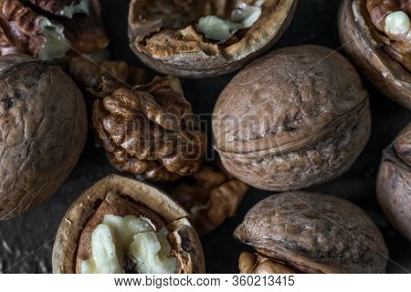 Halves Of The Kernel Of A Healthy Walnut Without Shell On A Dark Background, Walnut Macro Food Photo