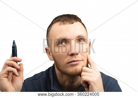 Man With Marker In His Hands Is Thoughtfully Looking Up On White Isolated Background.