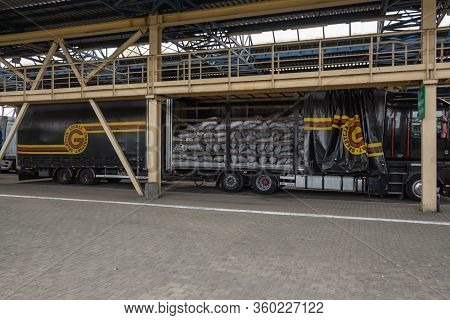 Krakovets, Ukraine - August, 2019: An Open Truck Trailer Carrying A Load Of Charcoal During Customs 