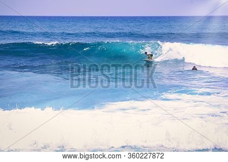 Hossegor, France - February Circa , 2019. An Unidentified Surfer Man Catching Riding On An Ocean Wav