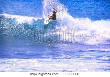 Hossegor, France - February Circa , 2019. An Unidentified Surfer Man Catching Riding On An Ocean Wav