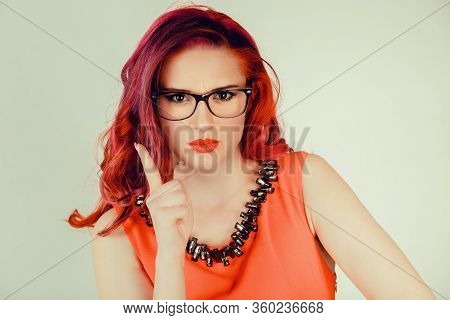 Attention, Listen To Me. Close Up Portrait Of Young Woman Wagging Her Finger Isolated Green Wall Bac