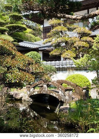 Sukumo, Japan - April 8, 2018: Traditional Japanese Garden With Pond On The Grounds Of Enkoji, Templ