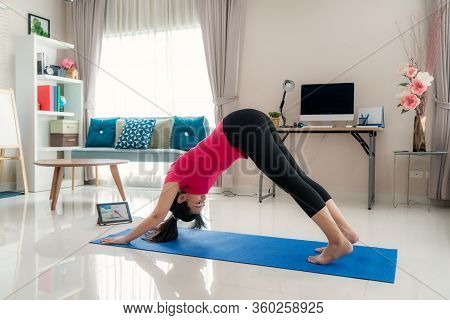 Asian Woman Making Yoga Exercise For Step Away From Their Computers To Take Mid-day Exercise Breaks 