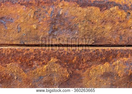 Heavily Rusted And Corroded Metal Sheet In An Industrial Area, Suitable As A Background, Pattern And
