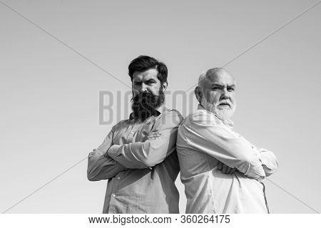 Elderly Senior Man And Bearded Son - Two Generation Concept. Man In Different Ages. Elderly Pensione