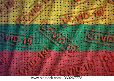Lithuania Flag And Many Red Covid-19 Stamps. Coronavirus Or 2019-ncov Virus Concept