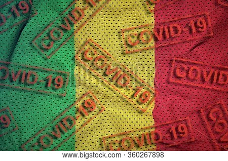 Mali Flag And Many Red Covid-19 Stamps. Coronavirus Or 2019-ncov Virus Concept