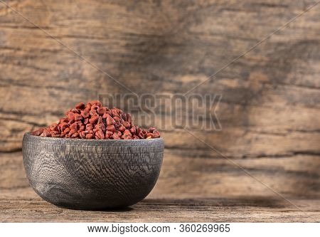 Bixa Orellana - Achiote Organic Seeds In The Wooden Bowl