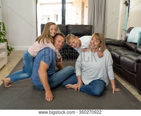 Covid-19 Stay At Home, Save Lives. Family In Staying Home Happy To Stop The Coronavirus Spreading.
