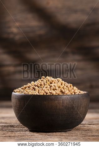Sinapis Alba - Organic Yellow Mustard Seeds In The Wooden Bowl