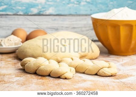 Unbaked braided bun dough. Raw dough. Unbaked buns.