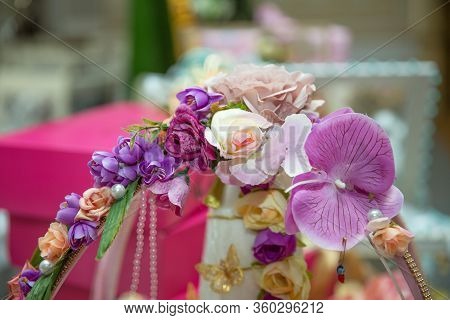 There Are Beautiful Flowers In The Handle Of The Basket . The Handle Of The Engagement Basket Is Dec