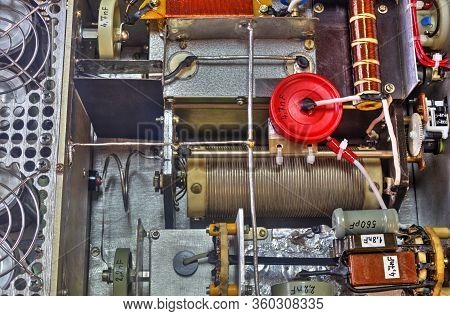 Inside View Of High Frequency Power Amplifier With Capacitors, Coils And Other Components