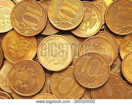 Russian Coins At 10 Rubles. Field Of Money Close Up. Illustration, Top View. Economics And Banks Of 