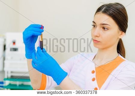 Blood Samples For Research In Microtubes. Testing In Laboratory. Nurse Holding Blood Test Tubes. Che