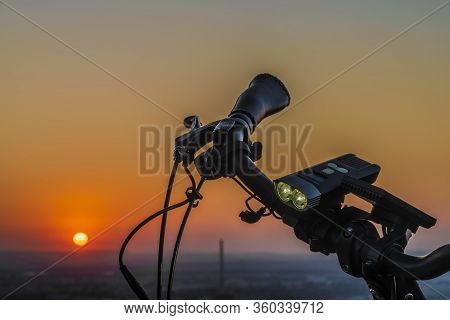 Handlebar Mirror And Light On Electric Bike In Sunset Color Evening