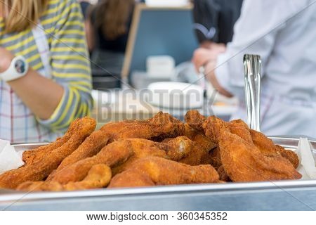 Pile Of Freshly Fried Chicken Chunks Ready To Be Served To Hungry Customers.
