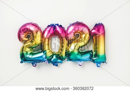 Rainbow Colored Foil Balloons In The Form Of Numbers 2021. New Year Celebration