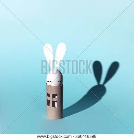 Easter Egg Bunny On Self-insulation. In The Toilet Paper Cabin. A Concept On Quarantine And Pandemic
