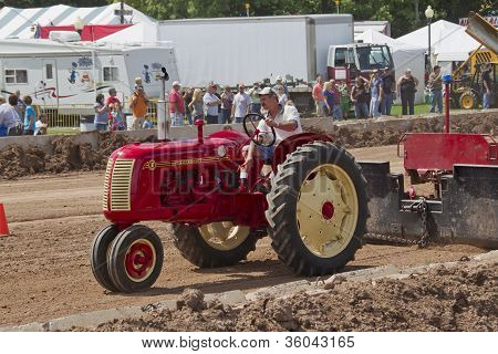 Red & Yellow Cockshutt Tractor Pulling Tracks