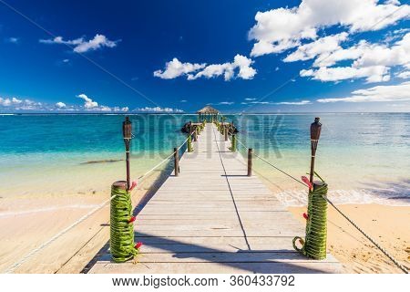 Vibrant tropical beach with palm trees, Upolu, Samoa.
