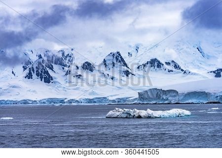 Iceberg Snow Mountains Blue Glaciers Dorian Bay Antarctic Peninsula Antarctica.  Glacier Ice Blue Be