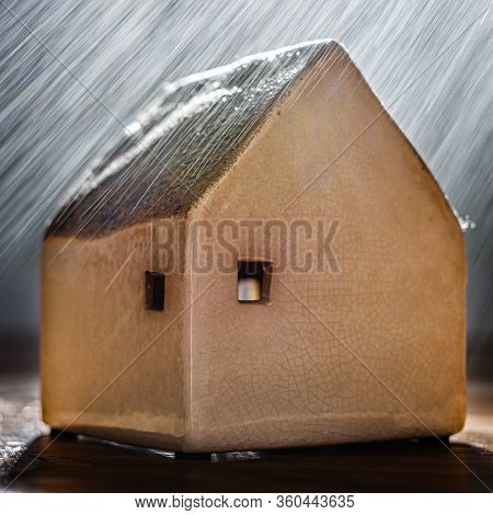 A Handmade Clay House Under The Rain